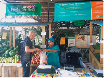 Photo // Charlotte Gibson Adrian Rosado helps local customer Thomas Hirschelmann choose ripe peaches on Thursday, August 28, 2014. 